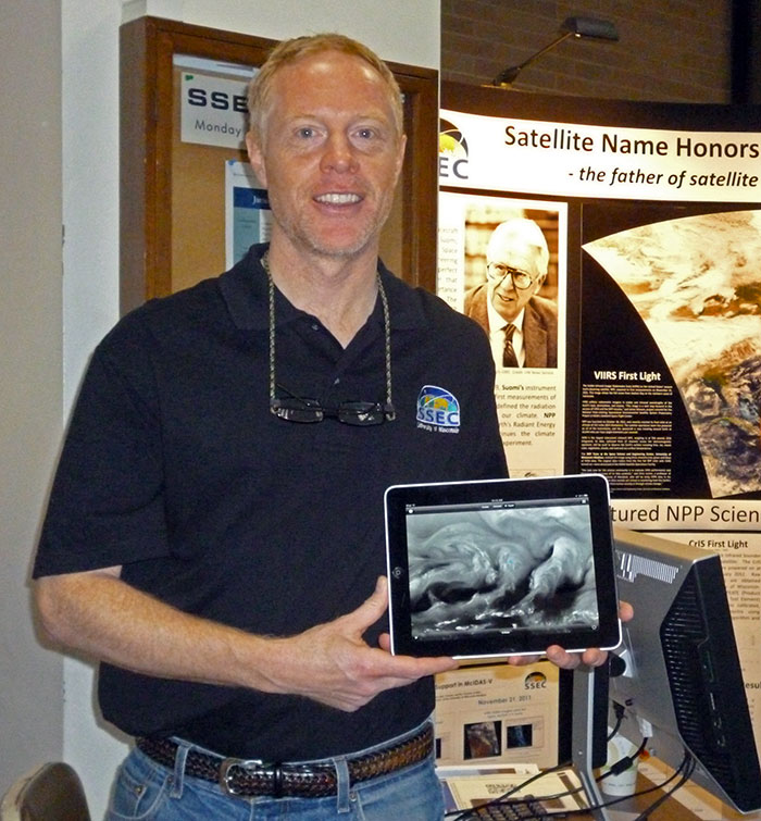 Sam Batzli demonstrates WxSat on an iPad at the UW-Madison Science Expeditions.
