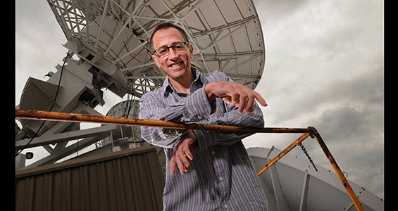 Jim Kossin on the roof of Atmospheric, Oceanic and Space Sciences Building. Photo Credit: Greg Anderson. Greg Anderson Photography.