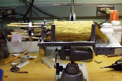 The magnetic salt-crystal cooling element (ADR) under construction. The 1600 gold wires are exposed while they are strung and connected to the four copper rods that will cool one of the Astro-E satellite’s X-ray detectors.
