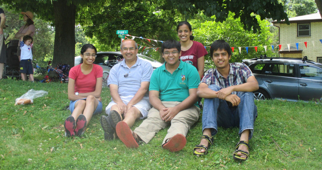 SSEC scientist and mentor Sanjay Limaye sits with the four university students from India conducting research at UW-Madison this summer through the S.N. Bose Scholars Program, which is in its second year.