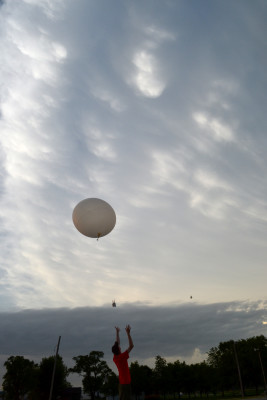 UW-Madison graduate student David Loveless launching a radiosonde into some mammatus clouds in Red Oak, IA. Credit: John Lalande, SSEC.