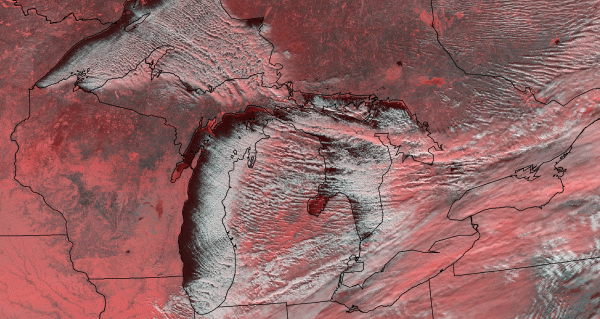 In satellite imagery, lake-effect snow appears as narrow, banded structures. Here, the long streaks of clouds formed by cold air interacting with open water are visible over the Great Lakes from Suomi NPP -- false color (red) differentiates ice and snow from clouds. Credit: CIMSS.